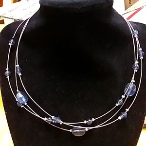 Blue bead and silver necklace.